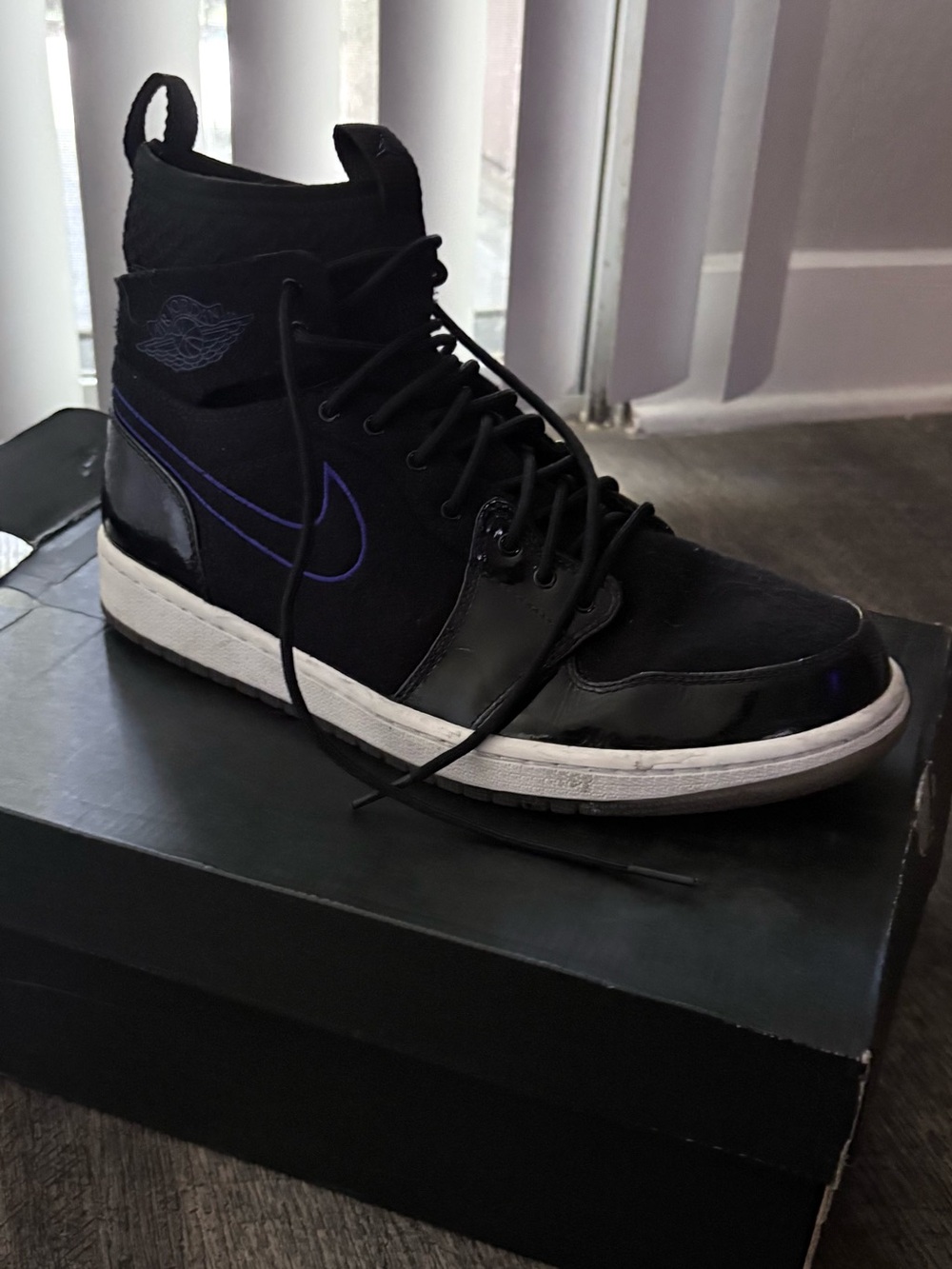 Jordan Men’s Black High-Top Space Sneaker with Purple Logo